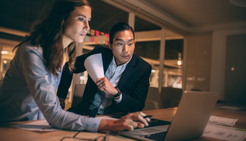 Business partners working late at night on laptop for making digital transformation