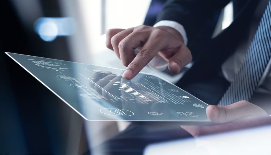 Man in business suit using digital devices to analyse data