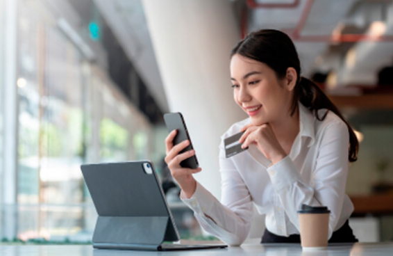 Woman working on her phone and ipad